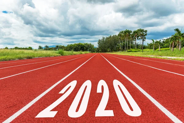 The start into the new year 2020. Start up of running on race track go to Goal of Success. Holiday sport Concept