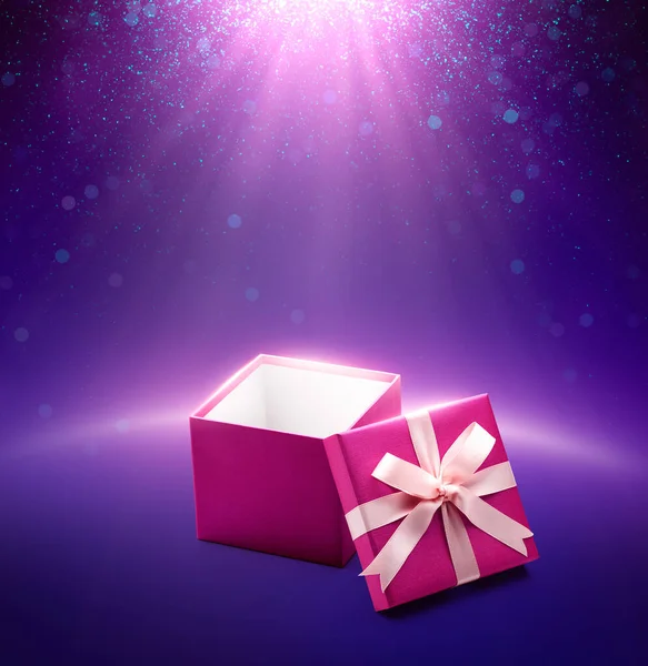 Pink color open gift box on purple glittering background