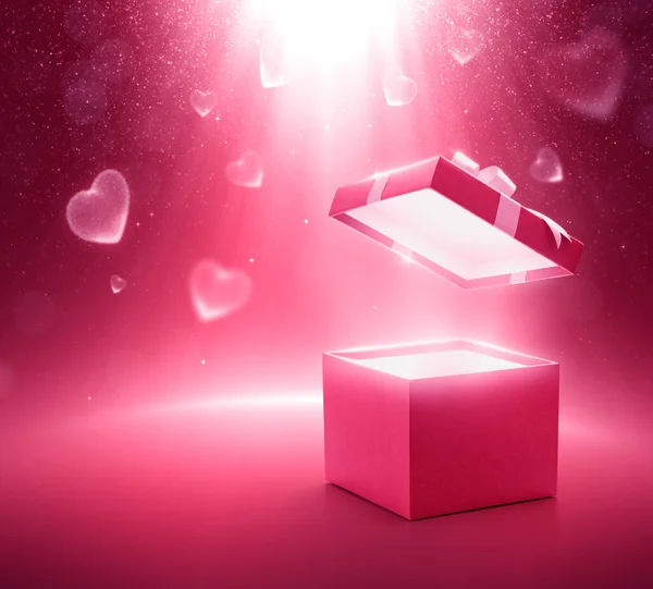Pink color open gift box on glittering background