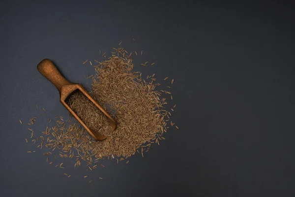 Caraway Seeds Wooden Shovel Black Background Top View — Stock Photo, Image