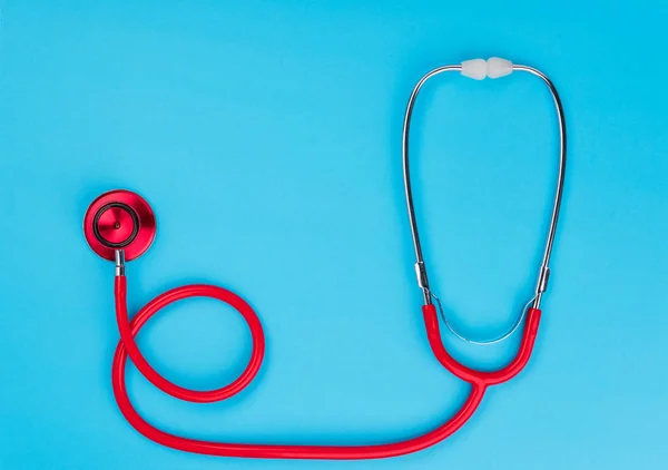 Red Stethoscope Blue Table Background Copy Space Text Medicine Concept — Stock Photo, Image