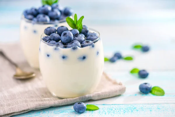 Two Servings Homemade Yogurt Fresh Blueberries Turquoise Wooden Background — Stock Photo, Image