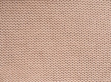 Bej renkli yün örme arka plan yakın çekim