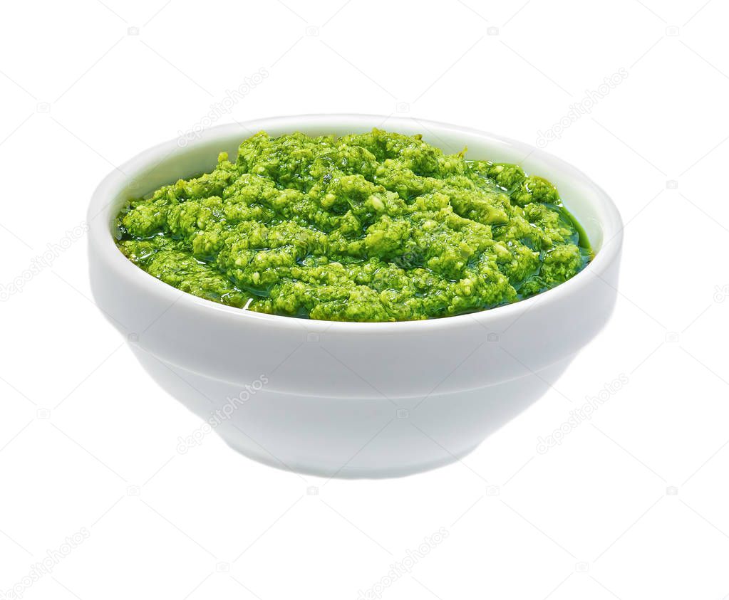 Pesto sauce in bowl isolated on white background. Portion of pesto sauce.