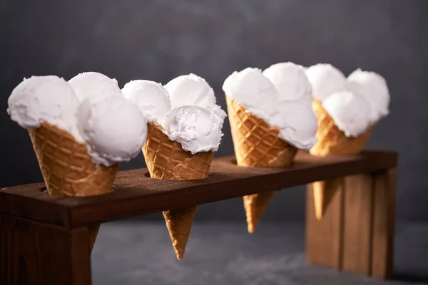 Vanilla ice cream on dark background, selective focus. — Stock Photo, Image