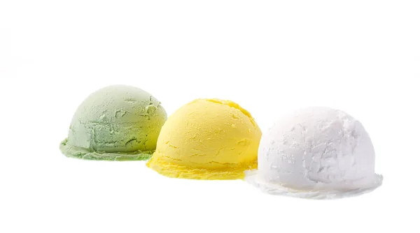 Three portions of different flavors of ice cream, green, yellow, white isolated on white background — Stock Photo, Image