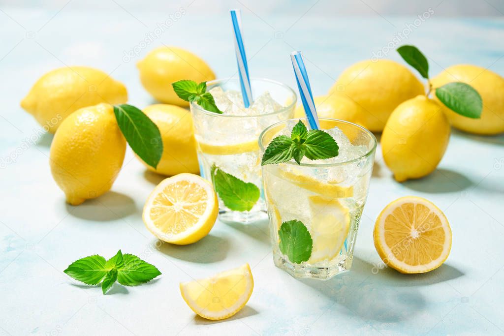 Cold sweet and sour lemonade juice with mint in the glasses