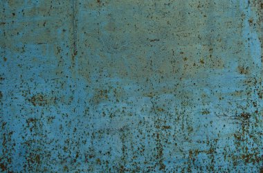 Metal yüzeyde pas lekeleri. Paslı mavi boyalı metal duvar