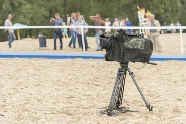 Television camera on the river beach. Camera for taking pictures on the beach