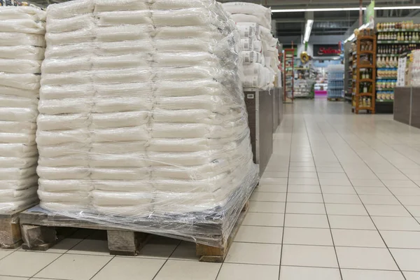 Sacks of flour in the supermarket. Warehouse with provisions