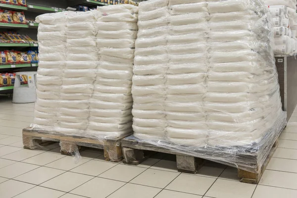 Sacks of flour in the supermarket. Warehouse with provisions