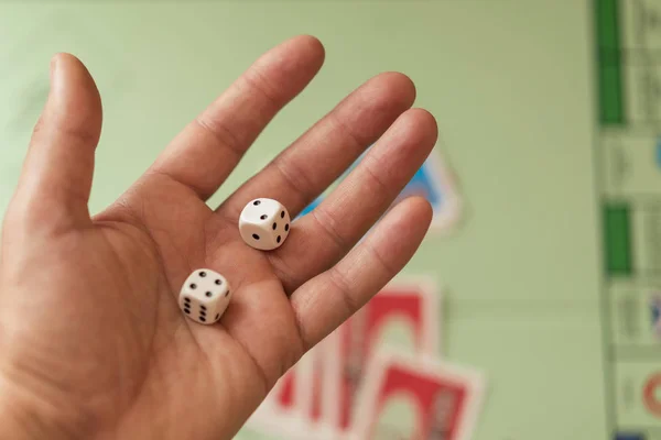 man holds the dice. Hand with dice