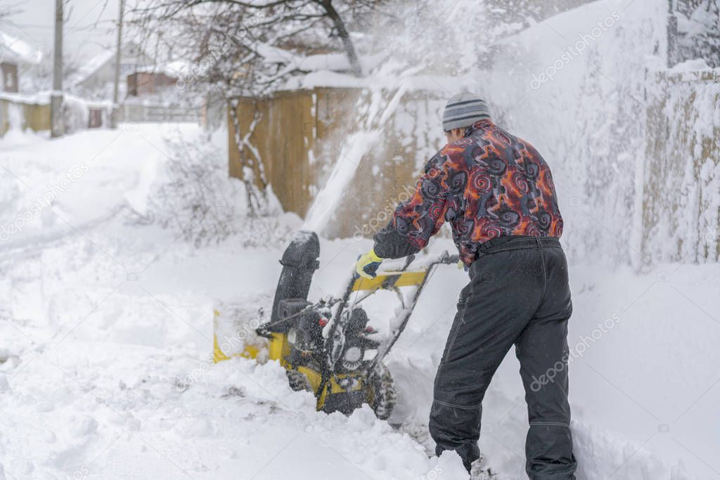 A snow thrower is the best assistant for snow removal in the winter. Snow Thrower outdoor.