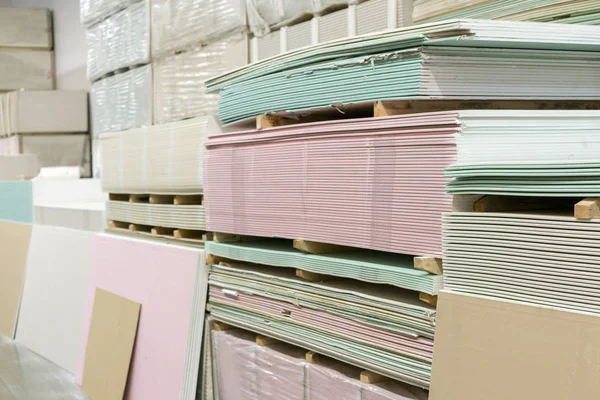 Warehouse with plasterboard. sheets of plasterboard on pallets.