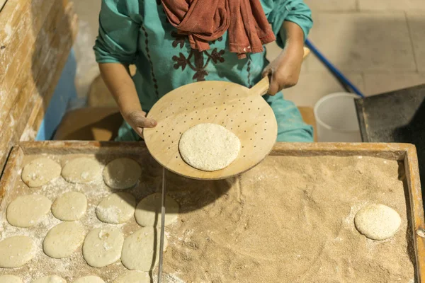 Woman bakes fresh cakes.