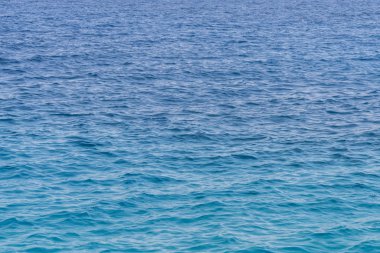 Mavi deniz arka plan. Mavi deniz yüzeyi dalgalar ile.