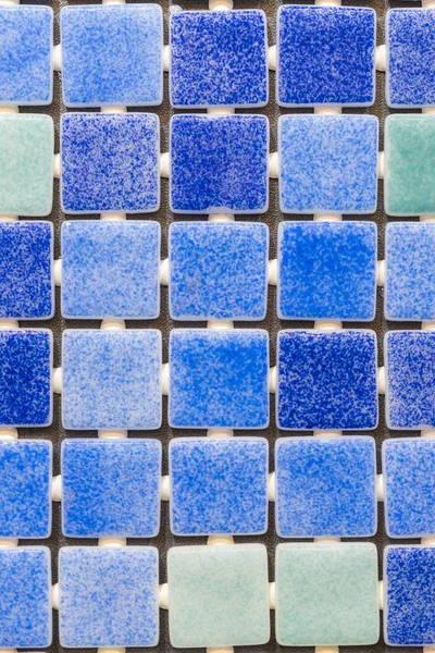 Blue mosaic tiles background. tile texture background of swimming pool tiles