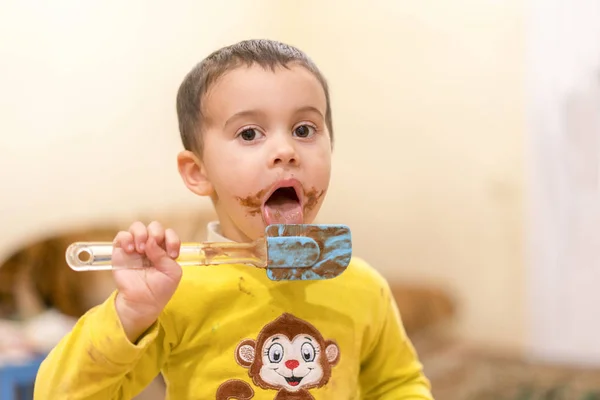 Happy Child Licks Spoon Chocolate Happy Boy Eating Chocolate Cake — Stock Photo, Image