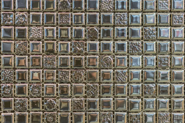 abstract square pixel mosaic wall background and texture. brown glass mosaic tile background pattern.