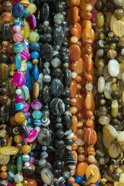 Background from beads. beads market necklaces. vertical photo