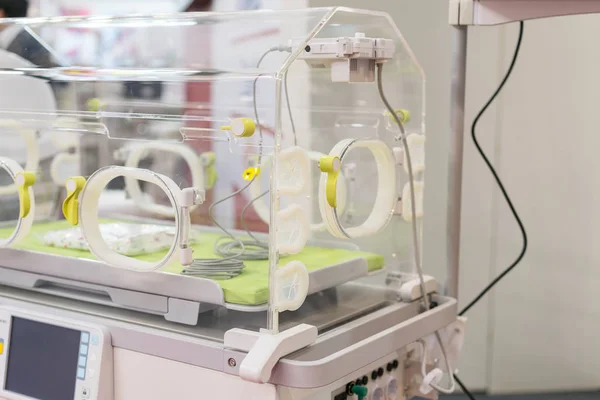 Empty infant incubator in an hospital room. Specially equipped room with newborn babys sleeping in incubators in the Obstetrics and Gynecology Hospital
