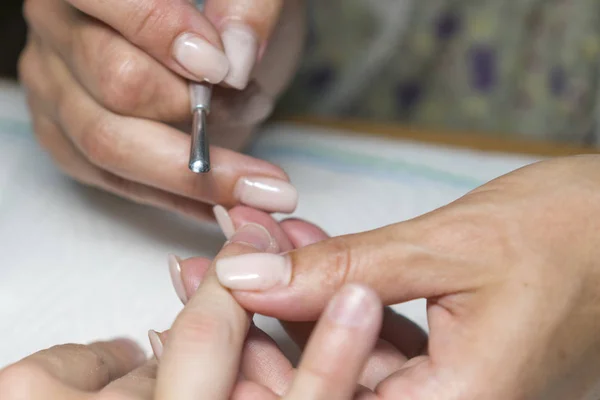 Manicure process in beauty salon, close up. female nail manicure processing — Stock Photo, Image