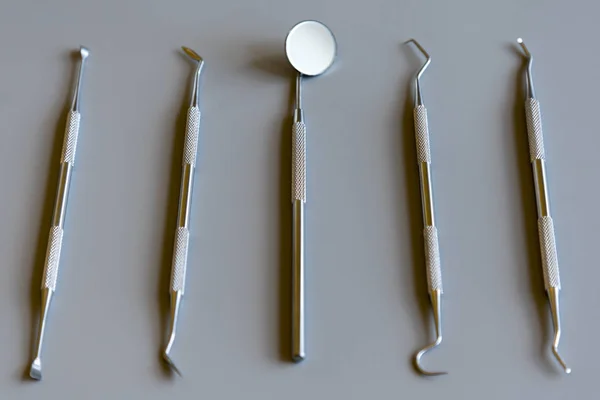 Dentist tools on gray background. copy space — Stock Photo, Image