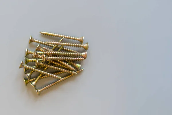 Screws on a gray background. Repair and maintenance concept. copy space — Stock Photo, Image