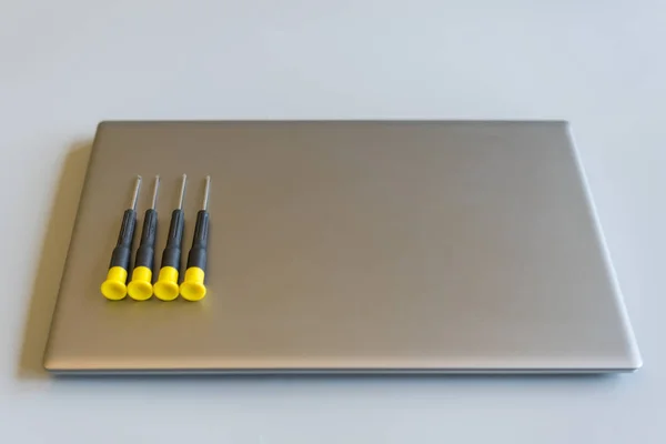 Screwdrivers on a laptop. computer repair concept. copy space — Stock Photo, Image