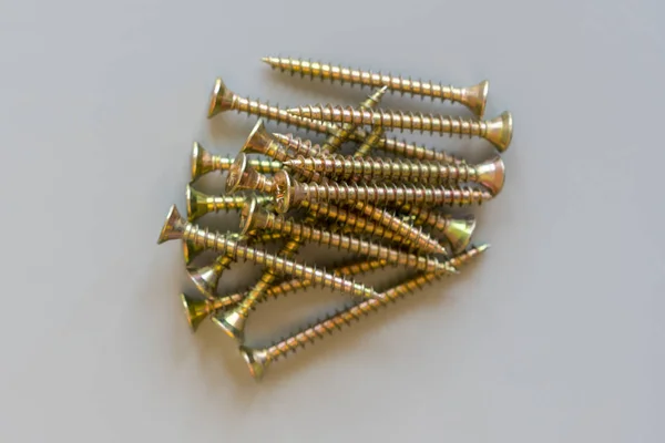 Screws on a gray background. Repair and maintenance concept. close up — Stock Photo, Image