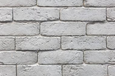 Beyaz dekoratif desenli, istiflenmiş taş, doğal taş kaplama. tuğla arka plan. Kapat. Arkaplan.