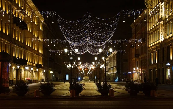 Christmas decoration of the city with electric glowing lights, Malaya Konyushennaya Street in St. Petersburg