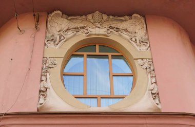 Fragment of the facade of an Art Nouveau residential building in St. Petersburg, Vosstaniya Street, oval window