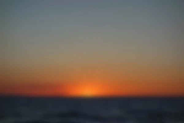 Sfondo sfocato: Tramonto in spiaggia — Foto Stock