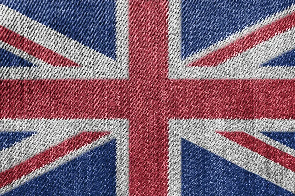 Gran Bretagna Concetto di industria tessile o politica: Jeans in denim con bandiera britannica — Foto Stock