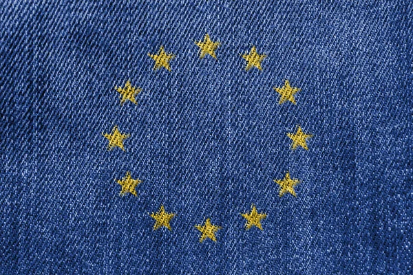 Avrupa Birliği'nin Tekstil Sanayi veya politika kavramı: AB bayrağı Denim Jeans doku arka plan