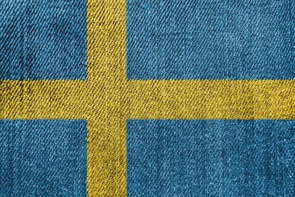 Concepto de industria textil o política de Suecia: Jeans de mezclilla de bandera sueca —  Fotos de Stock