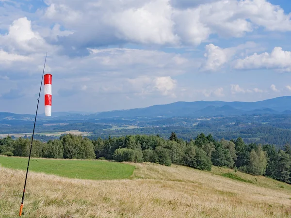 Red And White Wind Cone In A Hilly Landscape — Stock Photo, Image