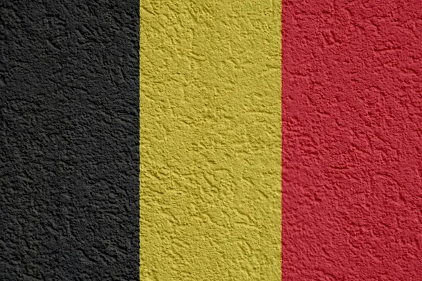 Polityka Belgii lub biznes koncepcja: Ściana banderą belgijską z gipsu, tekstura — Zdjęcie stockowe