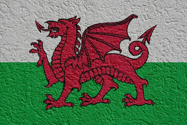 Wales politiek of businessconcept: Welsh vlag muur met gips, textuur — Stockfoto