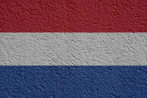 Nizozemské politiky nebo obchodní koncept: Holandský vlajka stěny s omítkou — Stock fotografie