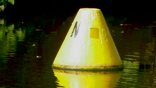 Yellow buoy Floating In The Water, Pan Shot — стоковое видео