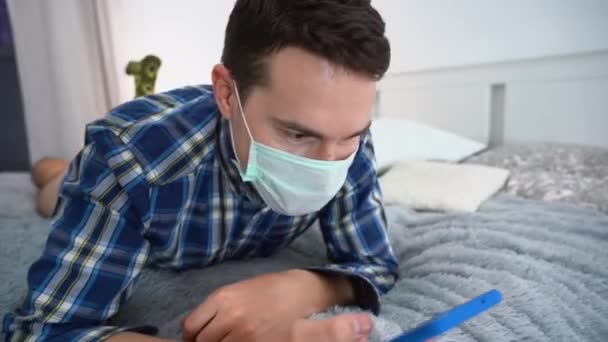 One Happy Handsome Young Man Wears Medical Face Mask Blue — Stock Video