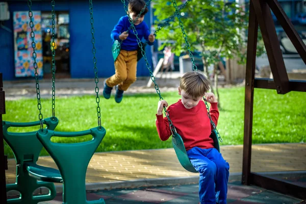 Smiling Little Boy His Brother Friend Swing Children Playing Outdoors — Stock Photo, Image