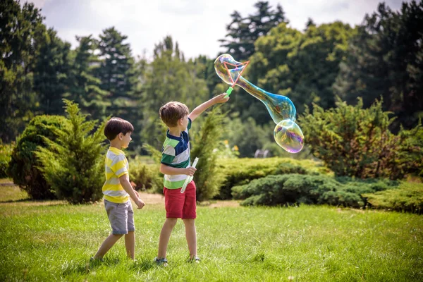 Boy Blowing Soap Bubbles While Excited Kid Enjoys Bubbles Happy — Stock Photo, Image