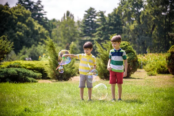 Boy Blowing Soap Bubbles While Excited Kid Enjoys Bubbles Happy — Stock Photo, Image