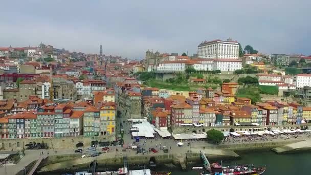 Panoramic view of the old city of Porto. One flew over the roofs of the houses, a river and a bridge. — Stock Video