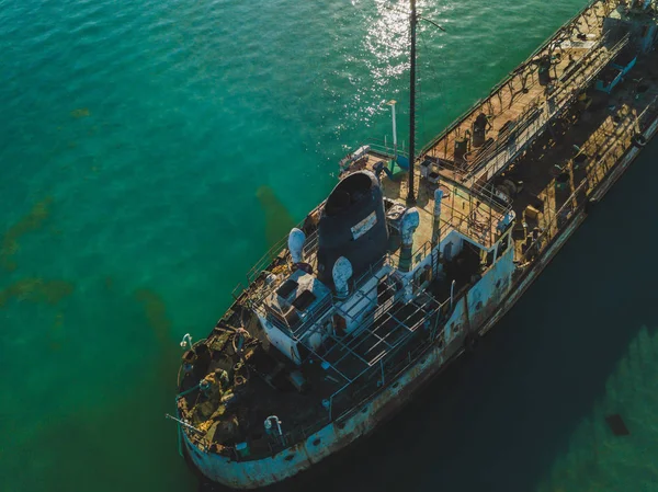 The thrown old ship has sat down on a bank. Aerial view