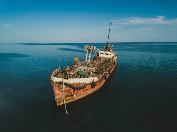 The thrown old ship has sat down on a bank. Aerial view