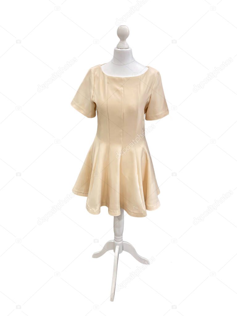A mannequin in a light brown calf-length skirt with gathered waist, standing on a simple metal stand against a plain vertically striped background